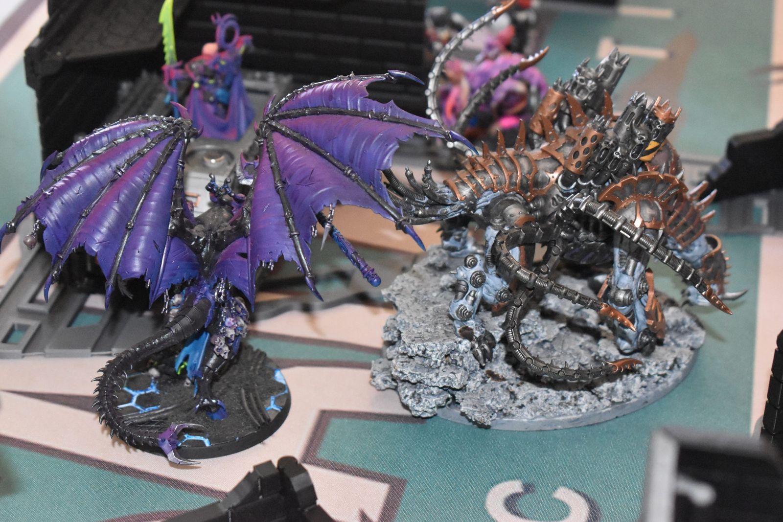 Painted Warhammer 40K monsters clashing in close combat