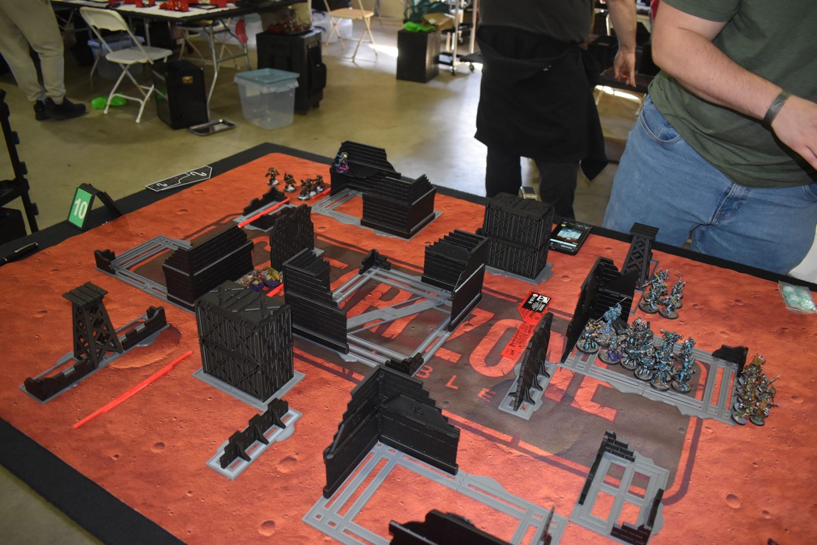 3D-printed ruins on a red tournament table